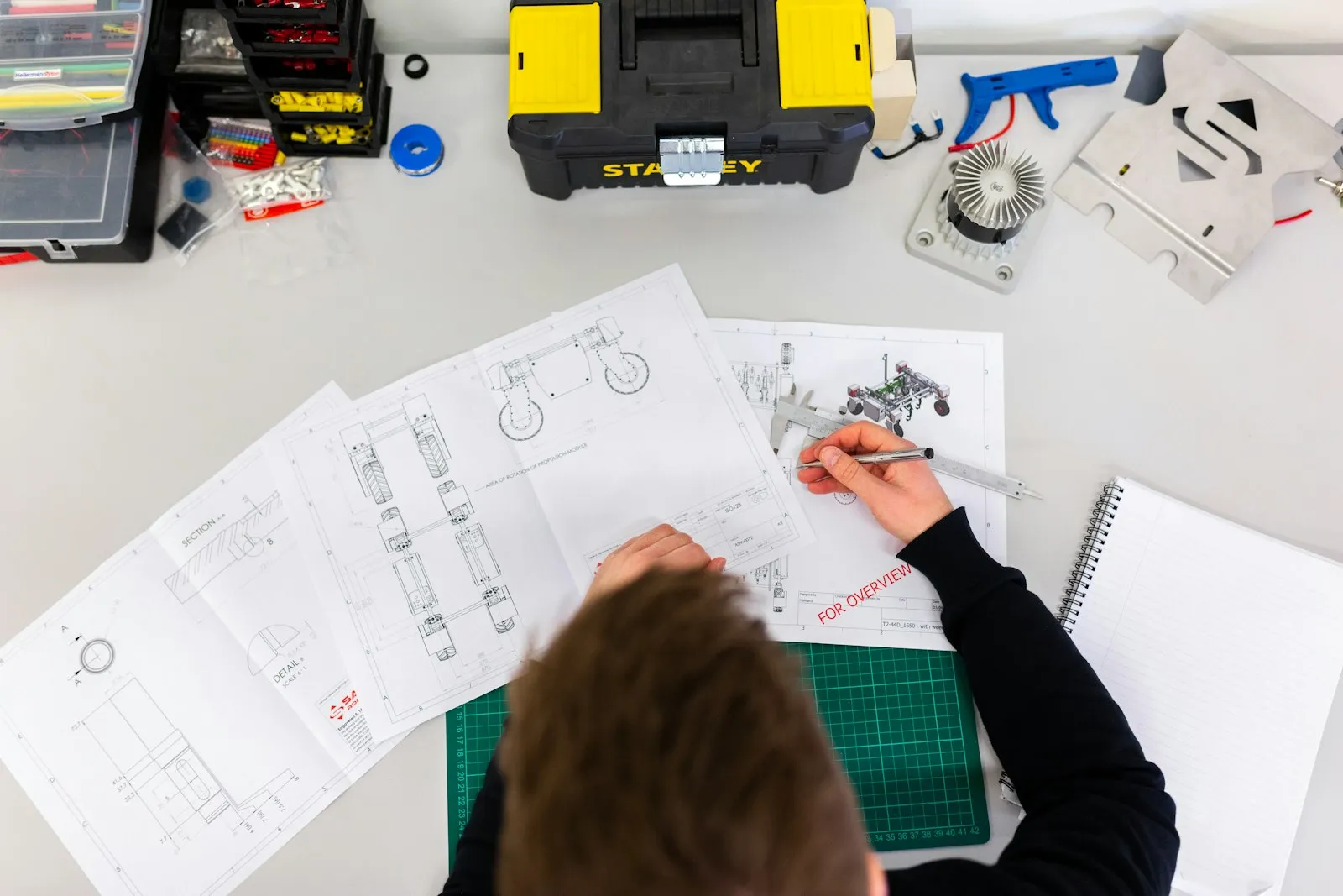 A technician working on an industrial assembly line