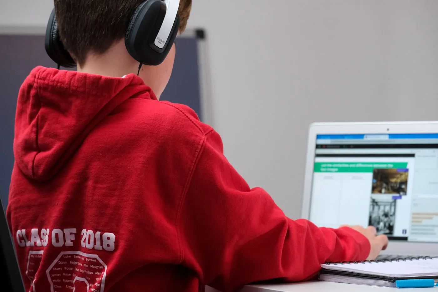 A young apprentice learning a hands-on technical skill